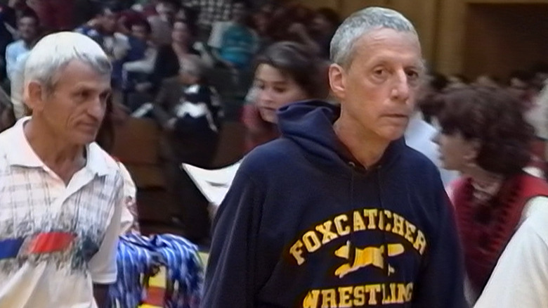 John du Pont walking Team Foxcatcher