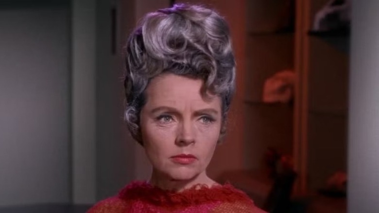 Amanda Grayson (Jane Wyatt) stands visibly upset in Star Trek: The Original Series