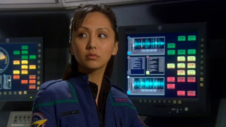 Hoshi Sato (Linda Park) looks away from her console in Star Trek: Enterprise