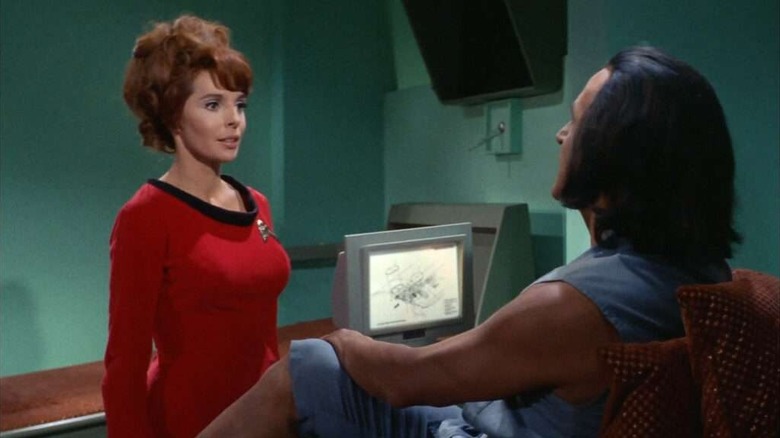Marla McGivers (Madlyn Rhue) speaks to Khan Noonien Singh (Ricardo Montalbán) in sickbay in Star Trek: The Original Series