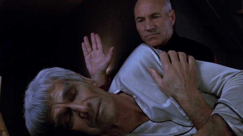 Jean-Luc Picard (Patrick Stewart) salutes an ailing Sarek (Mark Lenard) in Star Trek: The Next Generation