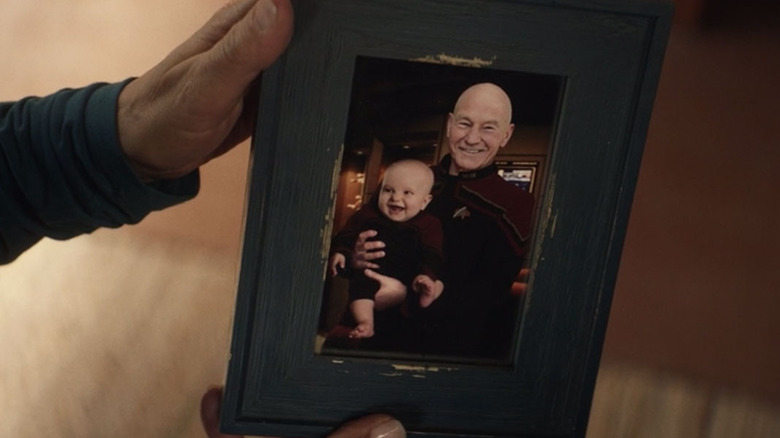 A framed photograph of Jean-Luc Picard (Patrick Stewart) holding an infant Thad Troi-Riker in Star Trek: Picard