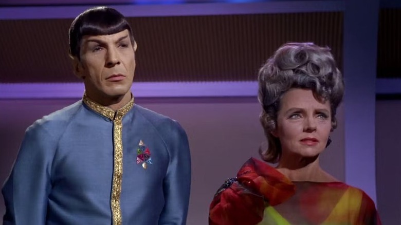 Spock (Leonard Nimoy) stands next to Amanda Grayson (Jane Wyatt) in Star Trek: The Original Series