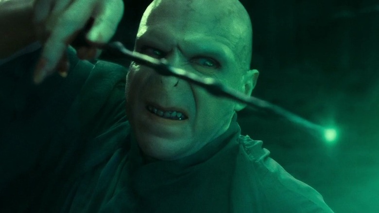 Voldemort (Ralph Fiennes) casting a green spell in Harry Potter and the Deathly Hallows - Part 2