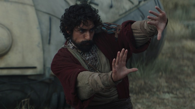 Ezra Bridger (Eman Esfandi) uses a Force push with both hands in Ahsoka