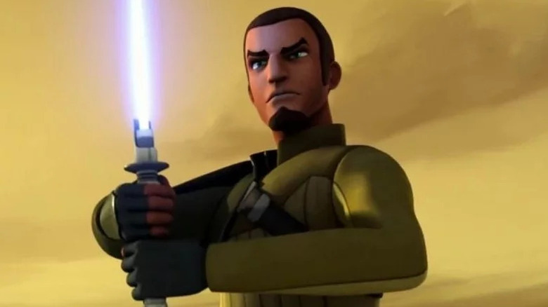 Kanan Jarrus (Freddie Prinze Jr.) holds his ignited blue lightsaber in Star Wars Rebels