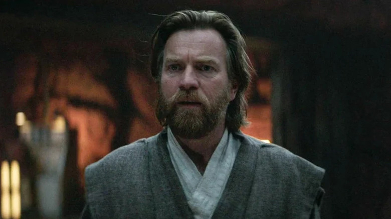 Obi-Wan Kenobi (Ewan McGregor) stands visibly distraught in Obi-Wan Kenobi