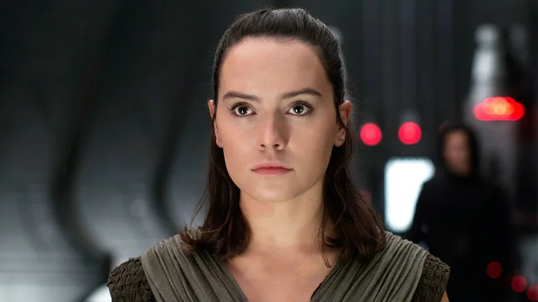 Rey (Daisy Ridley) stands in a First Order facility in Star Wars: The Last Jedi