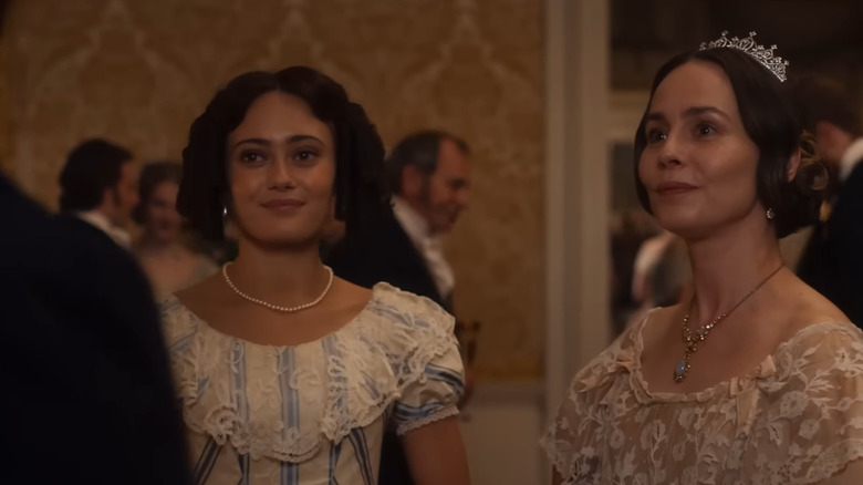 Maria (Ella Purnell) and Corinne (Tara Fitzgerald) smile uncomfortably in Belgravia