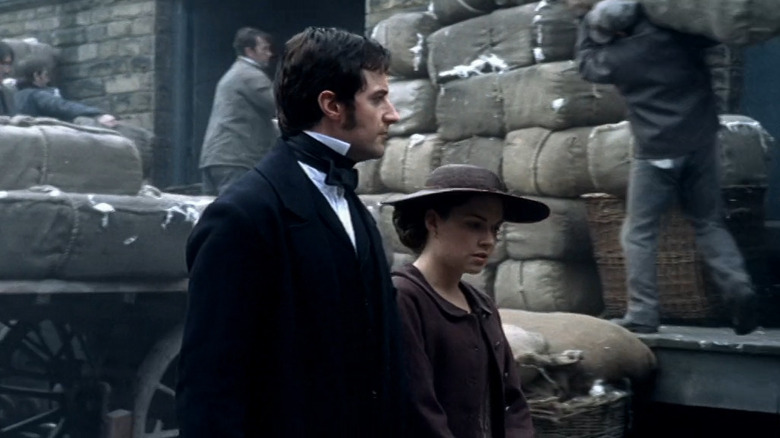 Mr. Thornton (Richard Armitage) and Margaret (Daniela Denby-Ashe) walk through factory yard in North & South