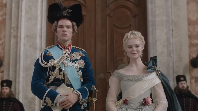 Tsar Peter (Nicholas Hoult) and Catherine (Elle Fanning) pose in full regalia in The Great