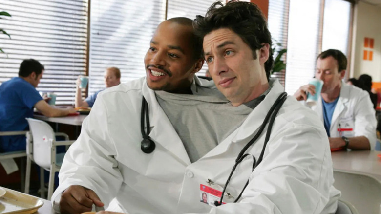 Turk (Donald Faison) and J.D. (Zach Braff) share clothes on Scrubs