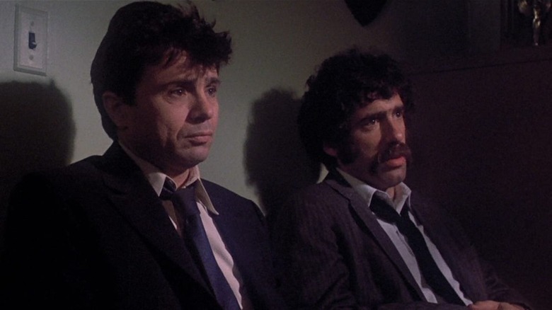 Elliott Gould and Robert Blake sitting politely