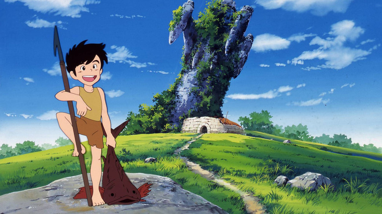 Conan holds a fish and spear by his overgrown home in Future Boy Conan