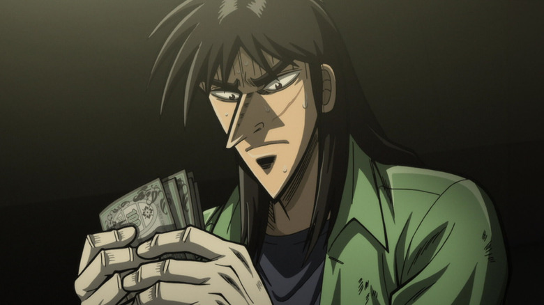Kaiji Itō nervously holds several yen notes in Kaiji