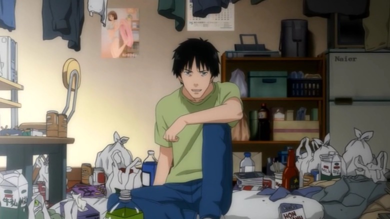 Tatsuhiro Satō sits in his trash-filled apartment in Welcome to the N.H.K.