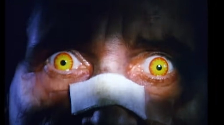 Closeup Jason Miller's demonic eyes from "The Exorcist III"