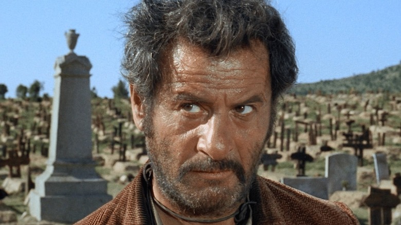 Tuco (Eli Wallach) glances up warily in a cemetery in The Good, the Bad and the Ugly