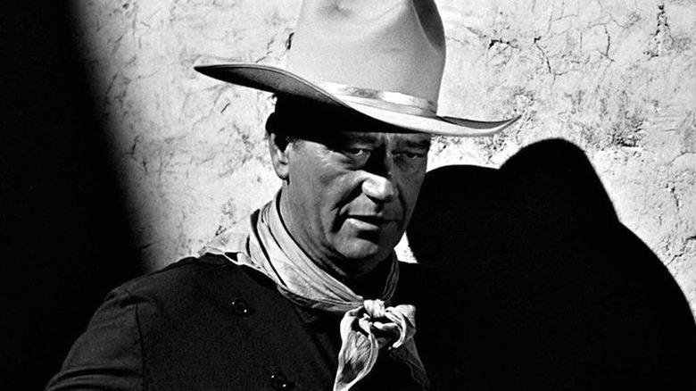 Tom Doniphon (John Wayne) stands in the shadows in The Man Who Shot Liberty Valance