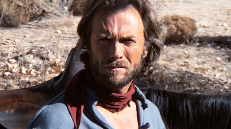 Josey Wales (Clint Eastwood) looks up sternly from his horse in The Outlaw Josey Wales