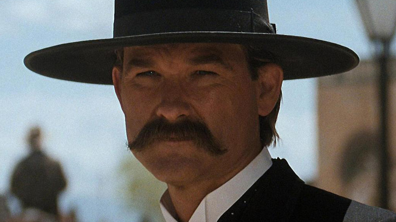 Wyatt Earp (Kurt Russell) peers into the distance in Tombstone