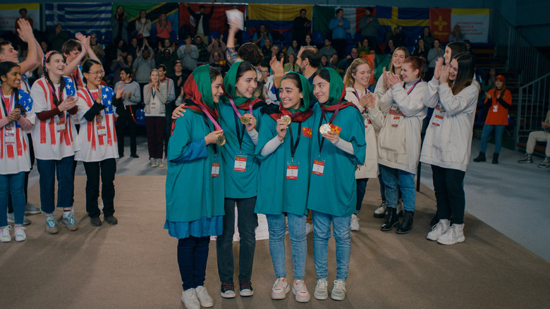 The Afghan youth girls robotics team accepts medals in Rule Breakers