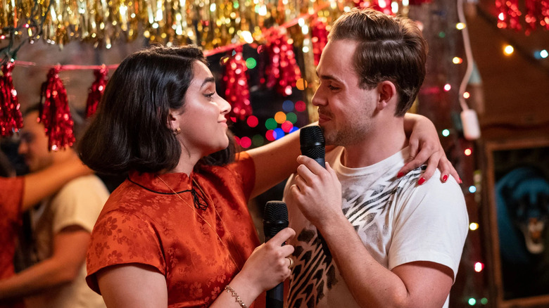 Geraldine Viswanathan and Dacre Montgomery as Lucy Gulliver and Nick Danielson, singing together in The Broken Hearts Gallery