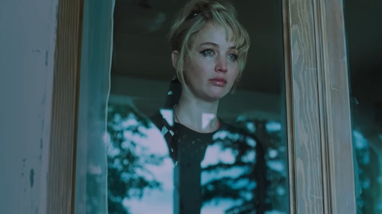 Grace (Jennifer Lawrence) staring out of a window in Die My Love