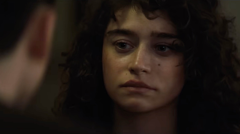 Rachel Mizler (Odessa A'Zion) looking sad while staring at Marty (Timothee Chalamet) in Marty Supreme