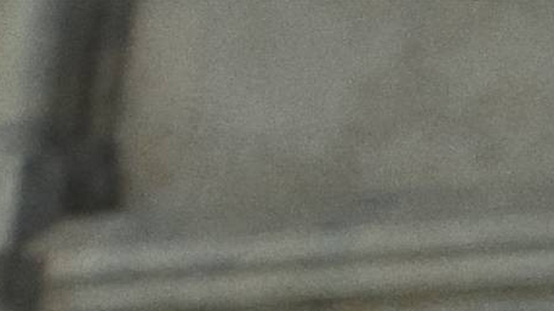 Benoit Blanc (Daniel Craig) looking at Father Jud (Josh O'Connor) in Wake Up Dead Man