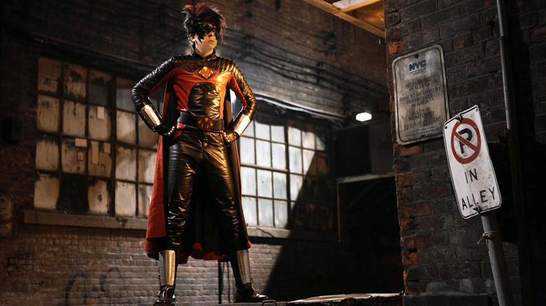 Christopher Mintz-Plasse as Red Mist standing heroically on a dumpster in Kick-Ass