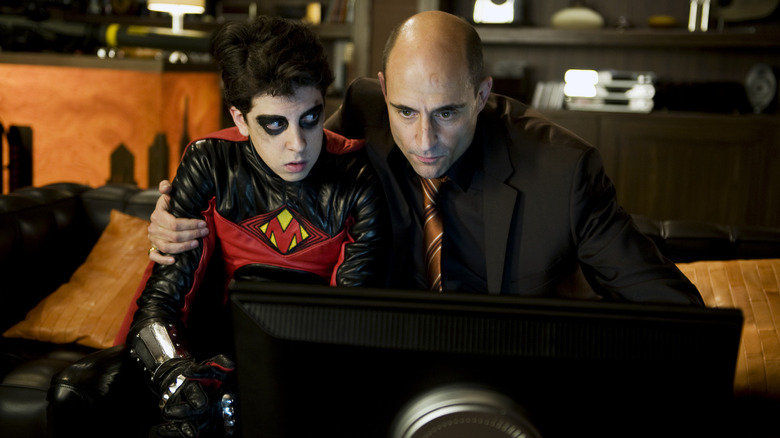 Mark Strong as Frank D'Amico sitting with Christopher Mintz-Plasse as Red Mist in Kick-Ass