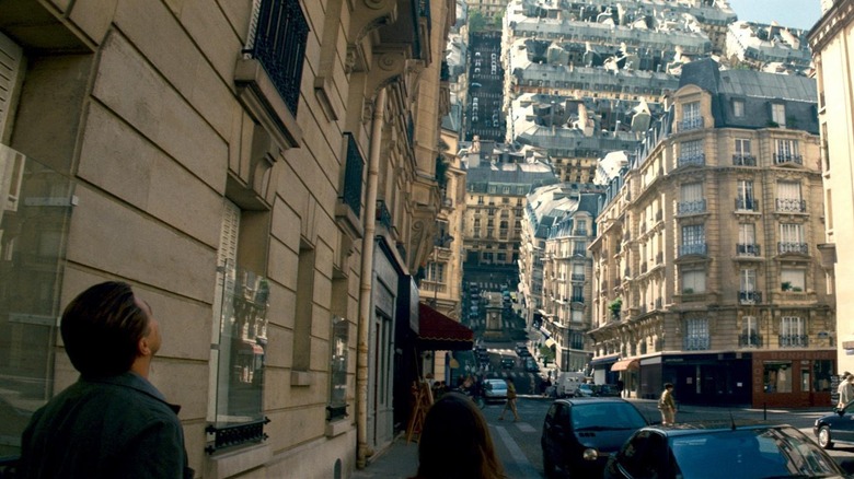 Cobb and Ariadne looking at the bending buildings in Inception