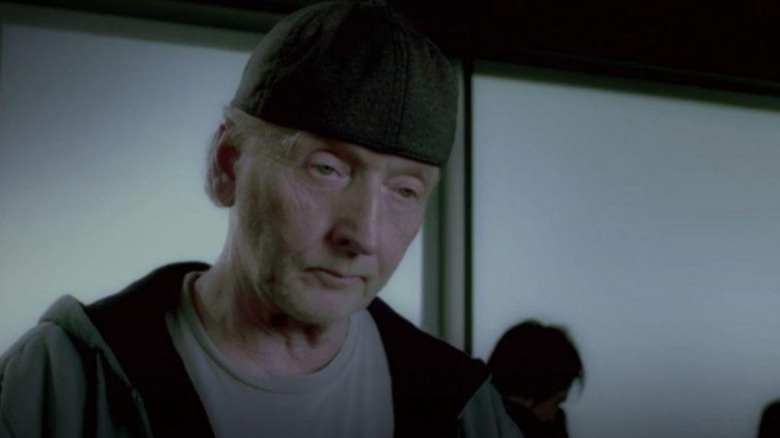 Tobin Bell as John Kramer with his hat on backwards in Saw 3D