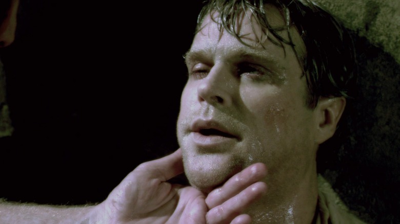 Cary Elwes as Dr. Gordon sweating and pale in Saw 3D