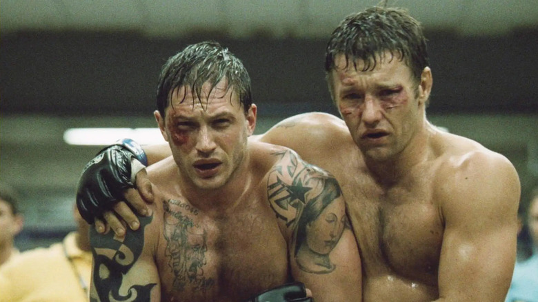 Tommy and Brendan Conlon holding each other and walking in Warrior (2011)