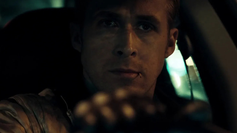 Ryan Gosling as Driver in the driver's seat of his car in Drive