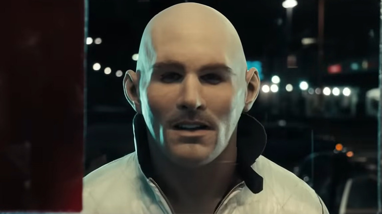 Ryan Gosling as Driver in his stunt mask walking up to the door in Drive
