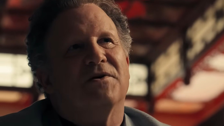 Albert Brooks as Bernie sitting at the table in Drive