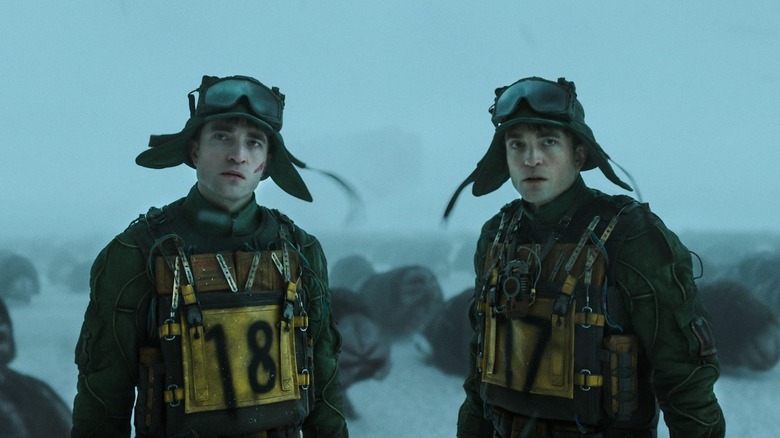 Robert Pattinson carries out a frigid mission as Mickey 17 and 18 in Mickey 17