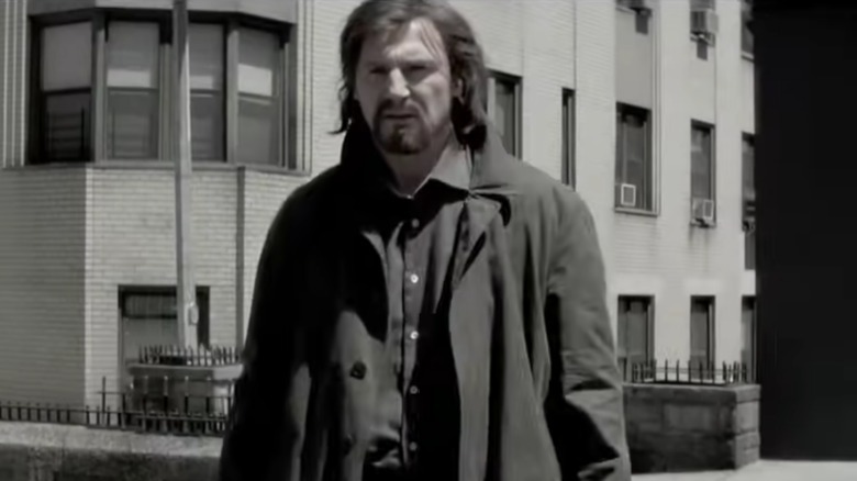 Liam Neeson wearing a coat