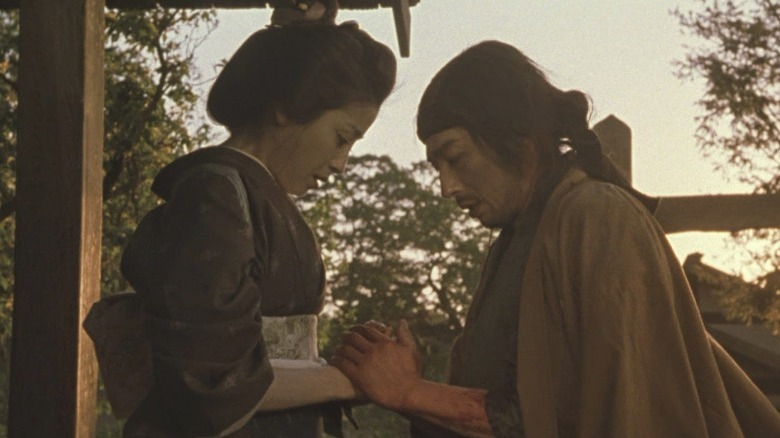 Seibei and Tomoe holding hands