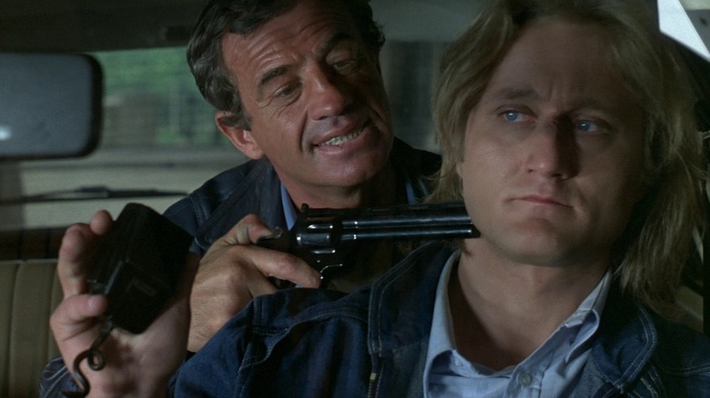 Jean-Paul Belmondo catching a cop in his cruiser