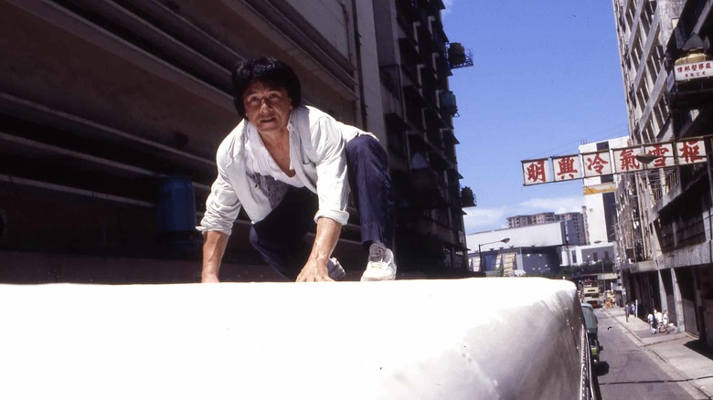 Jackie Chan atop a bus