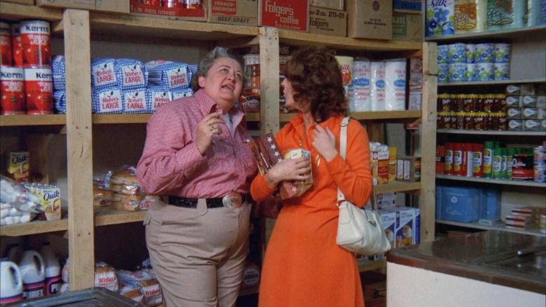 Two women talk in grocery store Fangs