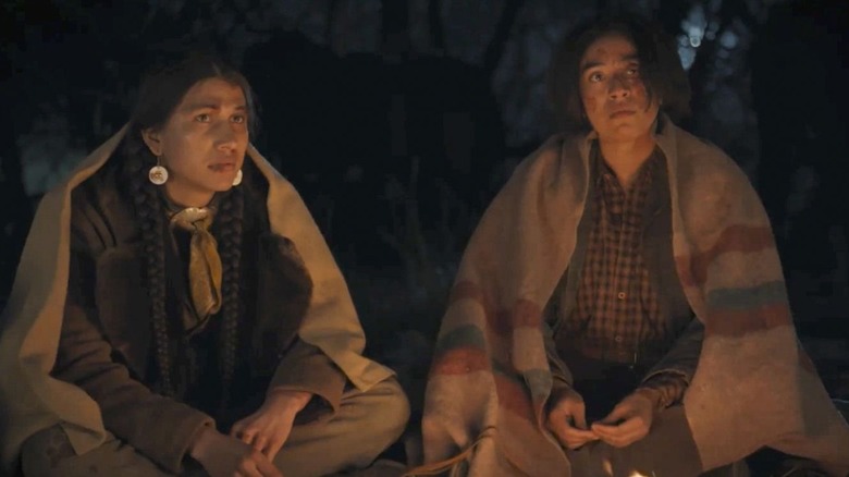 Pete Plenty Clouds and Teonna Rainwater sitting together around a fire