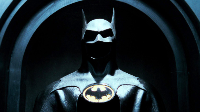 The Batman cowel is seen hanging in a chamber in Batman