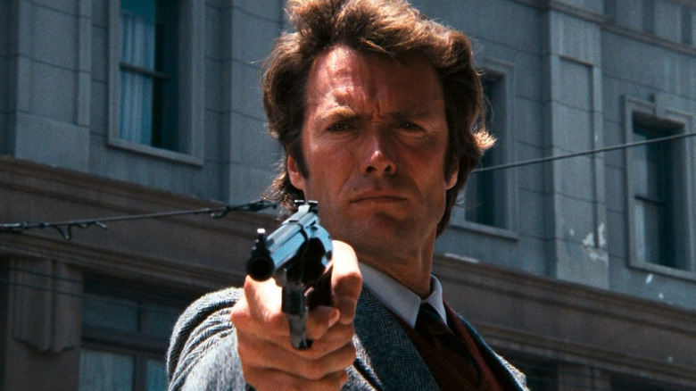 Harry Callahan (Clint Eastwood) points his gun in the street in Dirty Harry