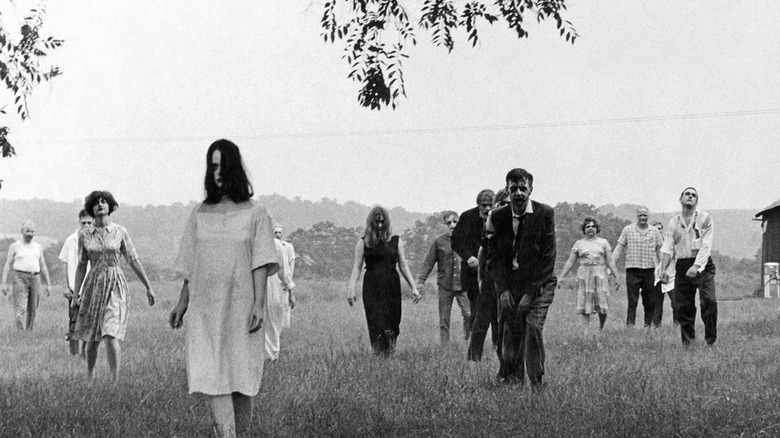 Zombies walk through field