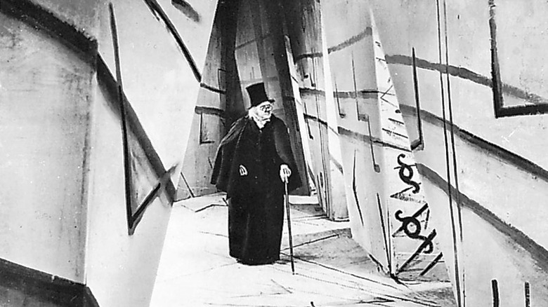 Dr Caligari walking down abstract street